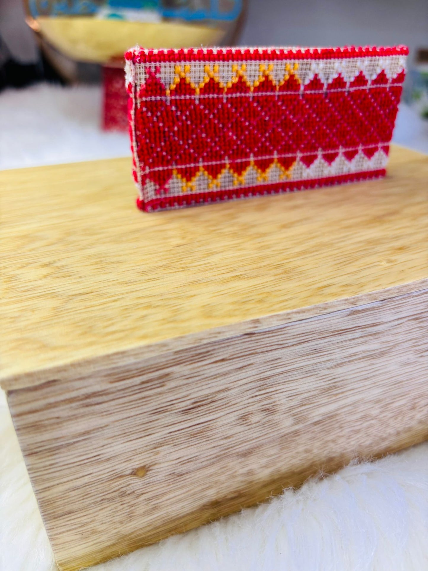 Wooden Box with Embroidered Vertical Handle.