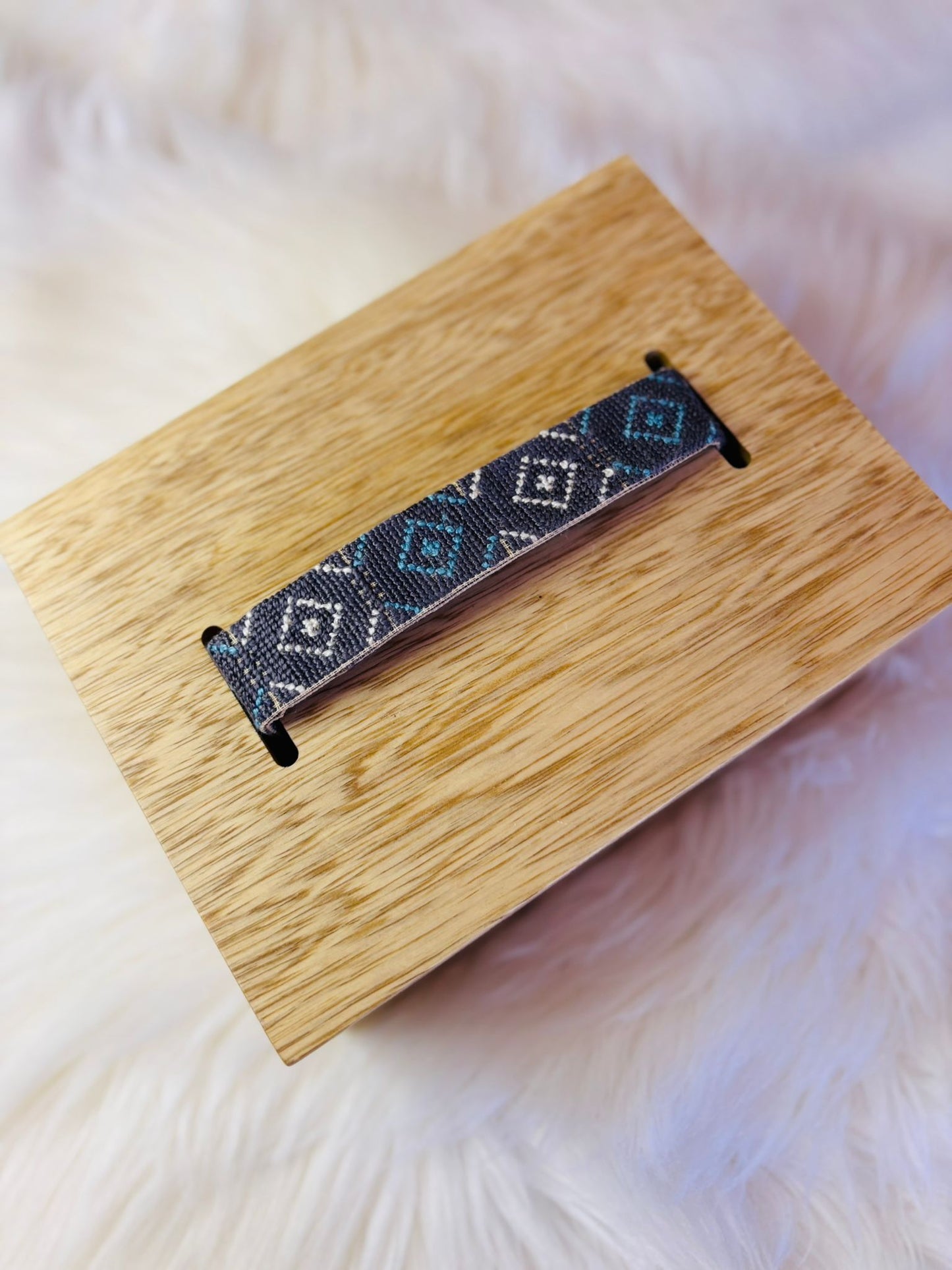 Wooden Box with Embroidered Loop Handle.